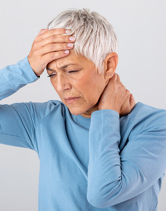 Photo of an older woman experiencing issues related to a hormone imbalance