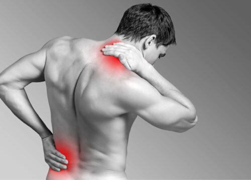 Photo of a man with back and neck pain