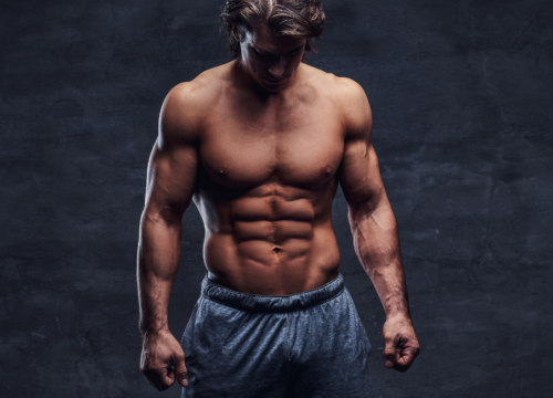 Photo of a shirtless muscular man
