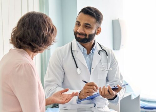 Photo of a doctor talking to a patient