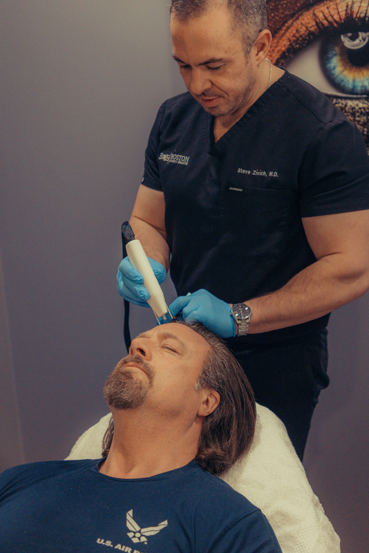 Photo of Dr. Steve giving a AgeJET™ treatment to a patient